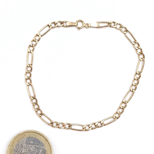 24 - A nine carat gold Figaro link bracelet. Weight - 1.22 grams.