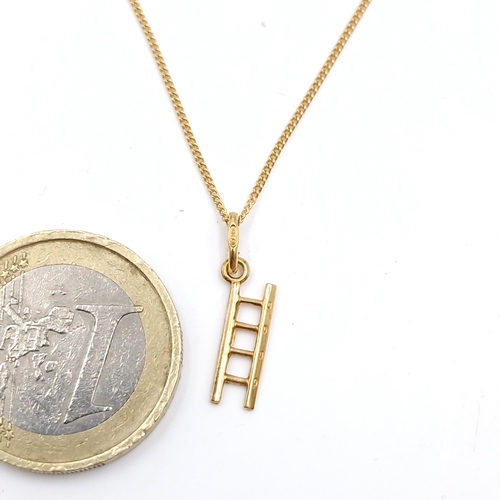 26 - Star Lot : A 18 carat gold 750 marked pendant and chain pendant necklace. Pendant in the form of a l... 