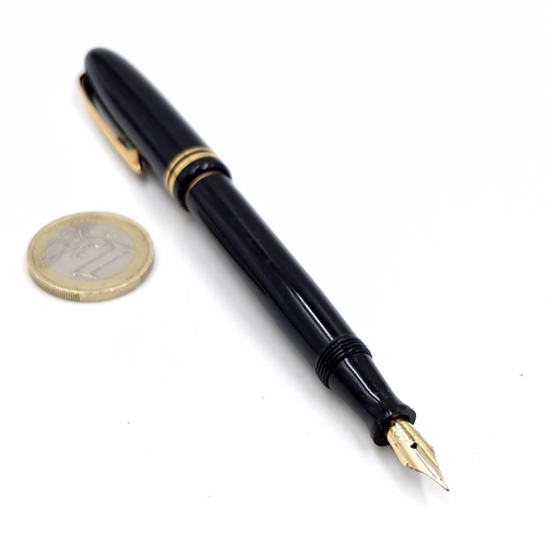 35 - A vintage Stylomine 303 black pen set with 18 carat nib. Item appears to be unused.