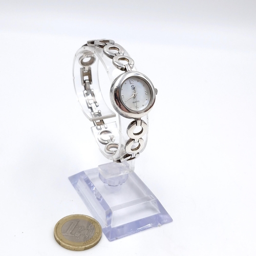 404 - A sterling silver ladies quartz wristwatch with mother of pearl face set with chain link metal brace... 