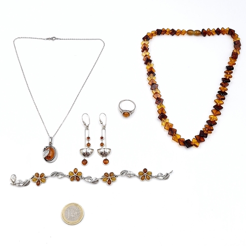 408 - An assorted collection of Baltic amber, a necklace: Length - 42 cms, A pendant with sterling silver ... 