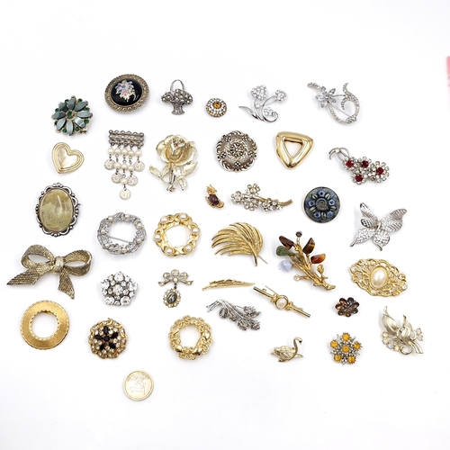 42 - A large collection of nice quality assorted brooches with pearl & gemstone set accents. Pins intact.... 