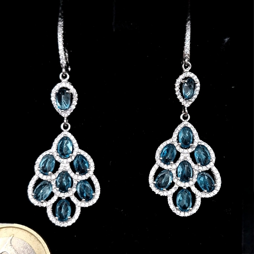 423 - A fine pair of blue topaz drop pendant earrings set with gemstone mounts - suitable for pierced ears... 