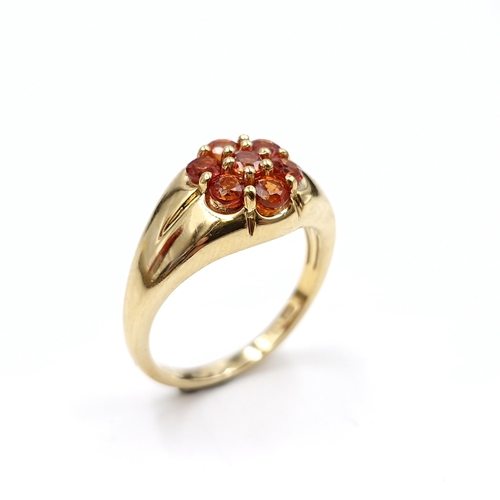 441 - A nine carat gold plated Mandarin topaz stone ring set with wide band mount with cluster setting. Ri... 