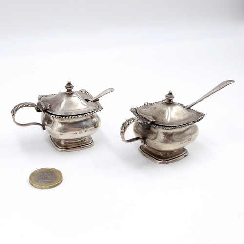 46 - Two Sterling Silver vintage mustard pots hallmarked Birmingham - 1932. Together with two spoons (one... 