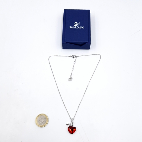 464 - A brand new Swarovski red gem set stone heart shaped pendant & chain. Length - 44 cms. Comes with ce... 