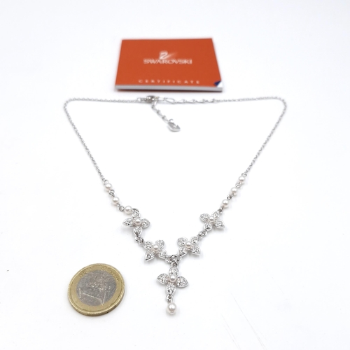 467 - A brand attractive Swarovski gem set and pearl mounted floral pendant necklace. Length - 44 cms. Com... 