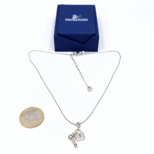 472 - An unusual brand new Swarovski lock & gem set key pendant with chain. Length - 42 cms. Comes with ce... 