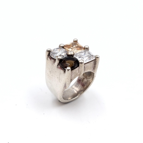 481 - A sterling silver Vari-hue sterling silver ring with citrine and smokey quartz . Ring size - P. Weig... 