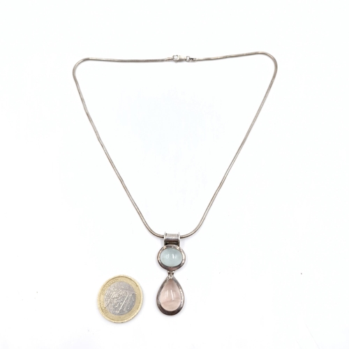 485 - A sterling silver moonstone pendant and silver chain. Length of chain - 40 cms. Weight - 18.54 grams... 