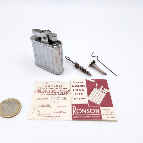 490 - A vintage Ronson whirlwind lighter together with maintenance items i.e. cleaning brushes. Comes in o... 