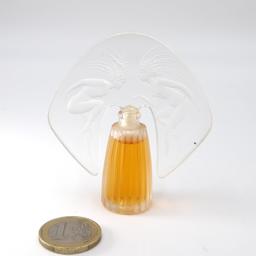 51 - Star Lot : A Lalique miniature perfume bottle designed with two nude art nouveau lady figures to the... 