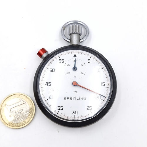 55 - A good example of a Breitling stop watch set in metal case. Watch working. Face diameter - 5 cms. We... 