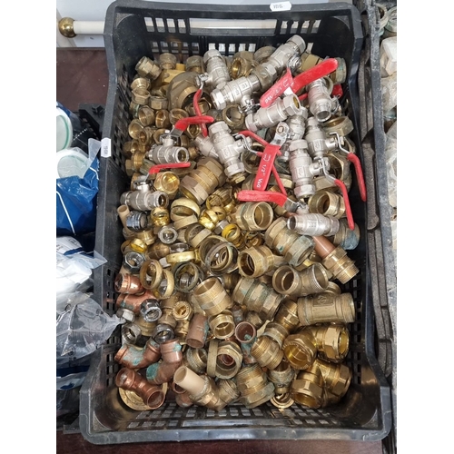 648 - Star Lot : Three crates containing assorted plumbing fittings and accessories, primarily brass, and ... 