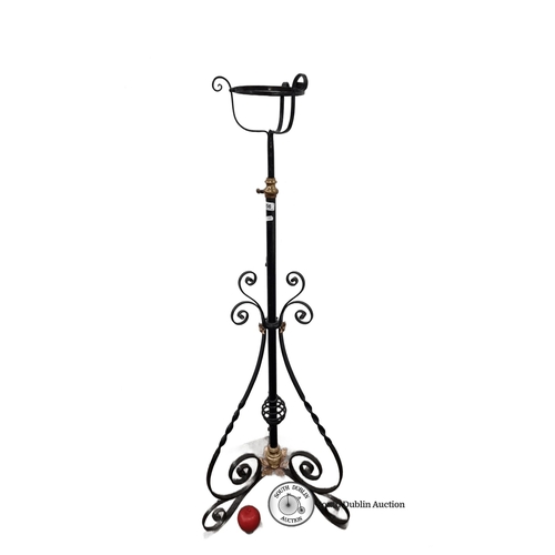 656 - Victorian wrought iron adjustable plant stand features brass valve detail and ornate scrollwork base... 