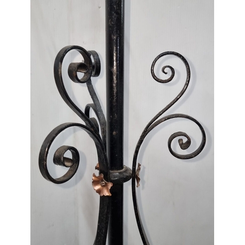 656 - Victorian wrought iron adjustable plant stand features brass valve detail and ornate scrollwork base... 