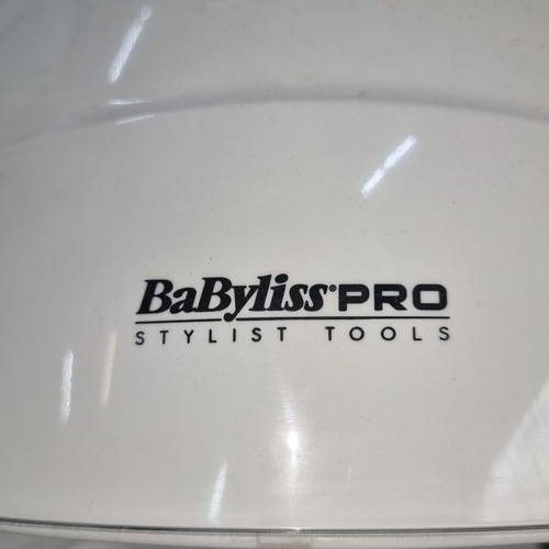 660 - BaByliss PRO Stylist Tools standing hair dryer features adjustable height and clear visor.