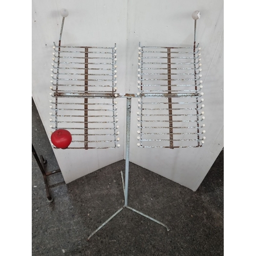 663 - A Vintage wire and metal rotating display stand with dual racks and tripod base. From a shop that cl... 