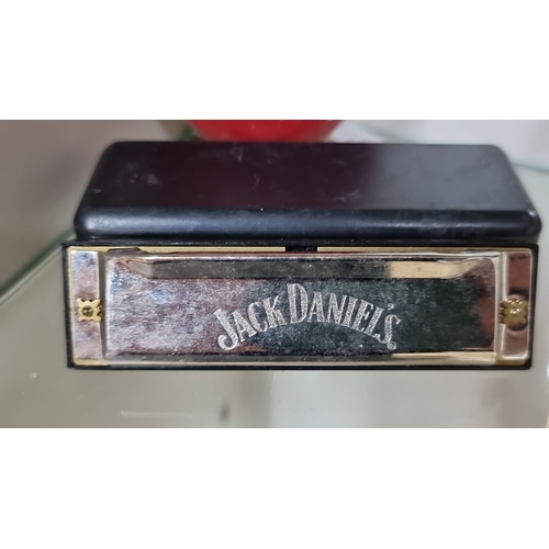 668 - Mixed lot featuring a Jack Daniel's harmonica, a Jameson Irish Whiskey belt buckle and flask, Jägerm... 