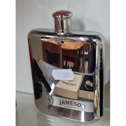 668 - Mixed lot featuring a Jack Daniel's harmonica, a Jameson Irish Whiskey belt buckle and flask, Jägerm... 