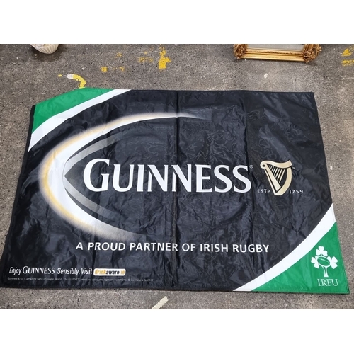 669 - Mixed lot of Guinness and IRFU memorabilia, including an IRFU flag, Guinness-branded golf club cover... 