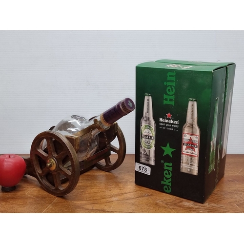 675 - An empyt Courvoisier Cognac bottle in a wooden cannon decanter holder. Accompanied by a boxed set of... 