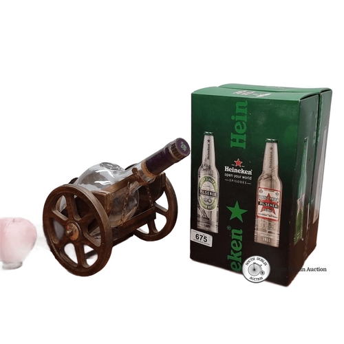 675 - An empyt Courvoisier Cognac bottle in a wooden cannon decanter holder. Accompanied by a boxed set of... 