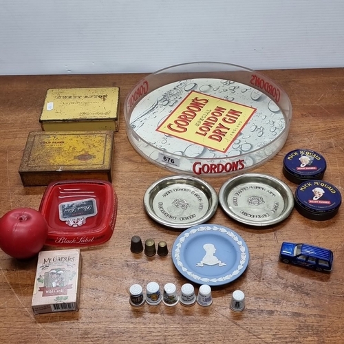 676 - Mixed lot containing Gordon's gin tray, vintage tobacco tin boxes, Black Label tray, thimbles, Wedgw... 