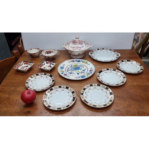 677 - A set of 12 Masons England Ironstone porcelain dishes includes plates, bowls, and a lidded tureen wi... 