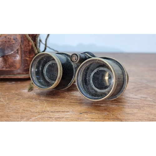 687 - Antique brass and leather filed glasses with original worn leather case feature intact lens and adju... 