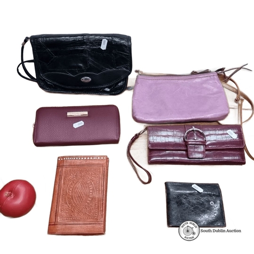 693 - Mixed lot comprising seven items: three leather wallets, one embossed leather notebook, one purple l... 