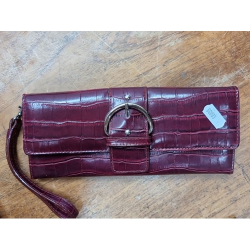 693 - Mixed lot comprising seven items: three leather wallets, one embossed leather notebook, one purple l... 