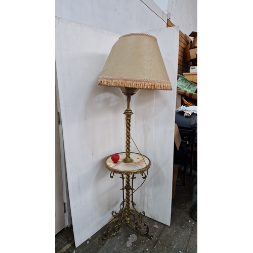 895 - Victorian brass floor lamp with marble-topped side table and detailed fringed shade. Features a twis... 