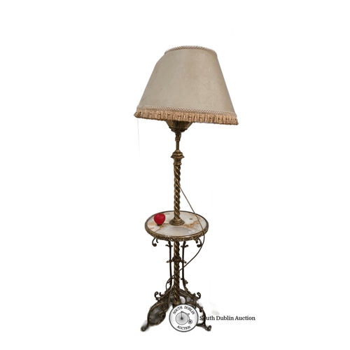 895 - Victorian brass floor lamp with marble-topped side table and detailed fringed shade. Features a twis... 