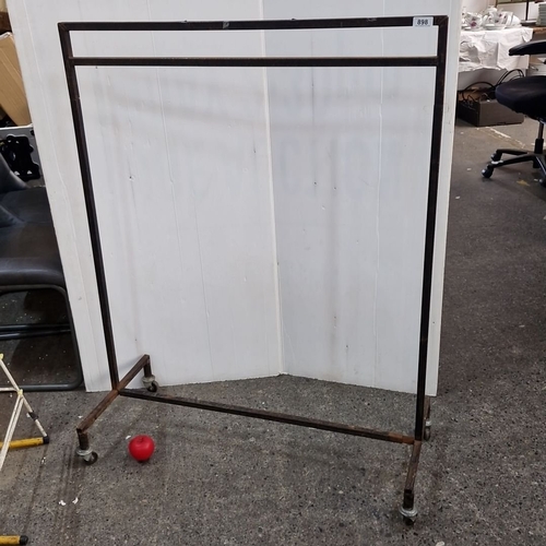 898 - Vintage commercial metal garment rack on casters.