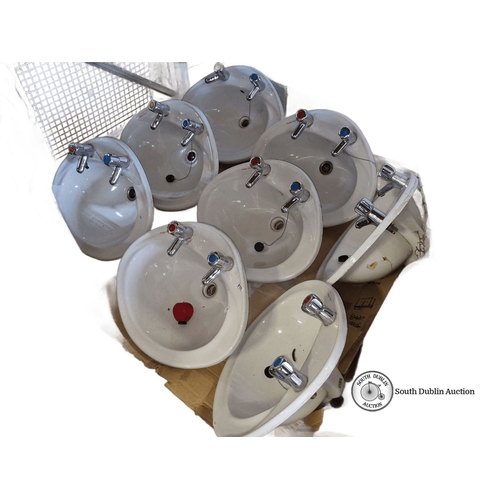 910 - Star lot: A Set of nine white Armitage Shanks ceramic sinks, each with dual hot and cold chrome taps... 