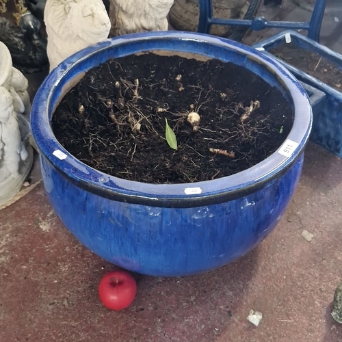 911 - A large Deep blue ceramic planter pot with a glossy finish.