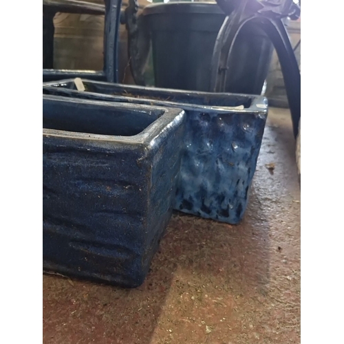 913 - A Pair of rectangular blue glazed ceramic planters.