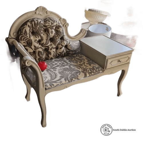 925 - A vintage telephone bench features ornate carved wood, curvilinear lines, and floral-pattern upholst... 