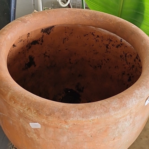 926 - A large Terracotta planter with natural patina.