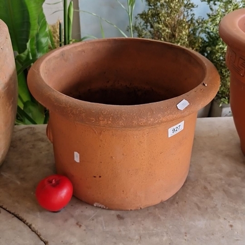 927 - A Large terracotta garden planter, classic design.