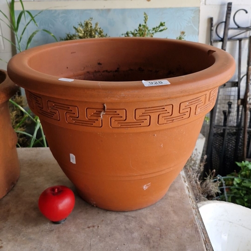 928 - A large Terracotta plant pot with Greek-key motif along the rim. It has a smooth, wide lip and a cla... 