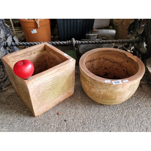 929 - Set of two terracotta planters including one square and one round design.