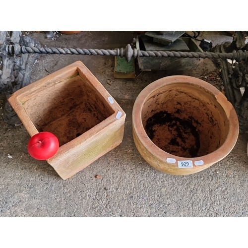 929 - Set of two terracotta planters including one square and one round design.