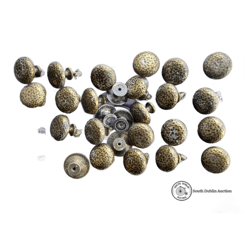 935 - A Set of 19 textured brass toned drawer knobs.