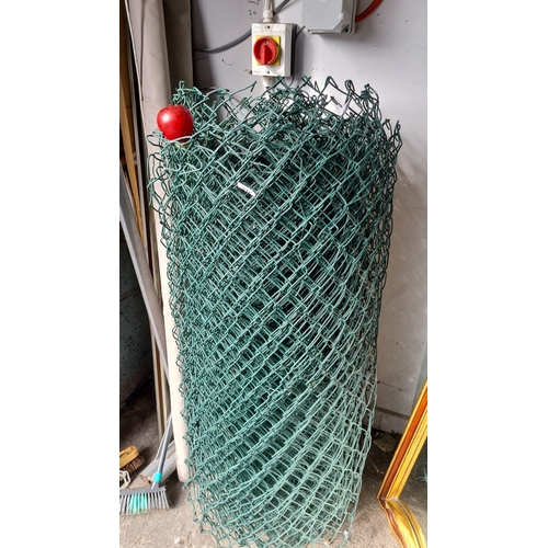 936 - A Roll of green chain-link fencing.