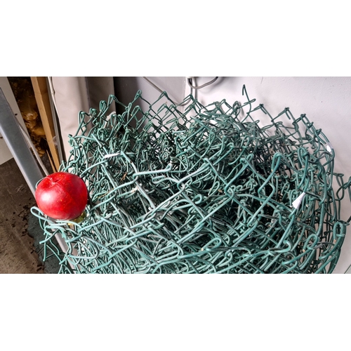 936 - A Roll of green chain-link fencing.