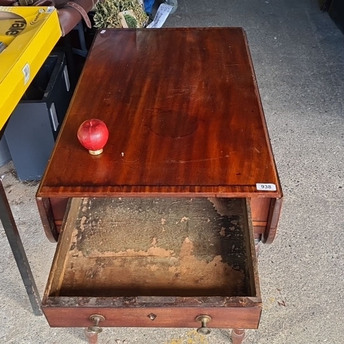 938 - A 19th-century drop-leaf mahogany table with one drawer and brass pulls, featuring elegant turned le... 