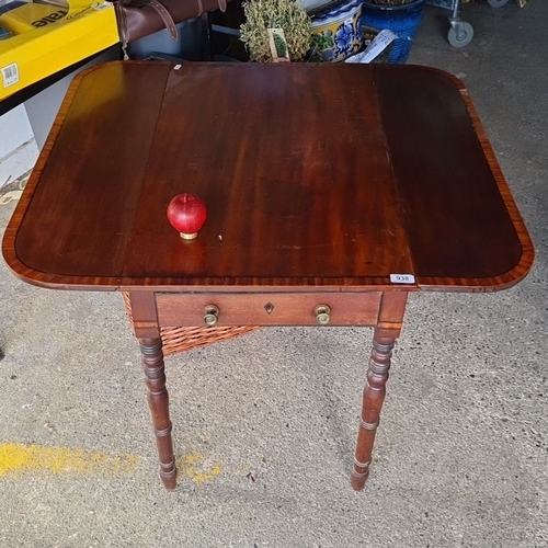 938 - A 19th-century drop-leaf mahogany table with one drawer and brass pulls, featuring elegant turned le... 