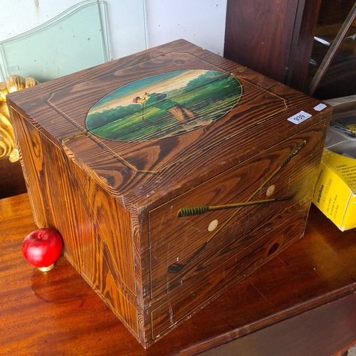 939 - A vintage Wooden storage box with hinged lid, featuring a painted golf scene and crossed clubs. Inte... 